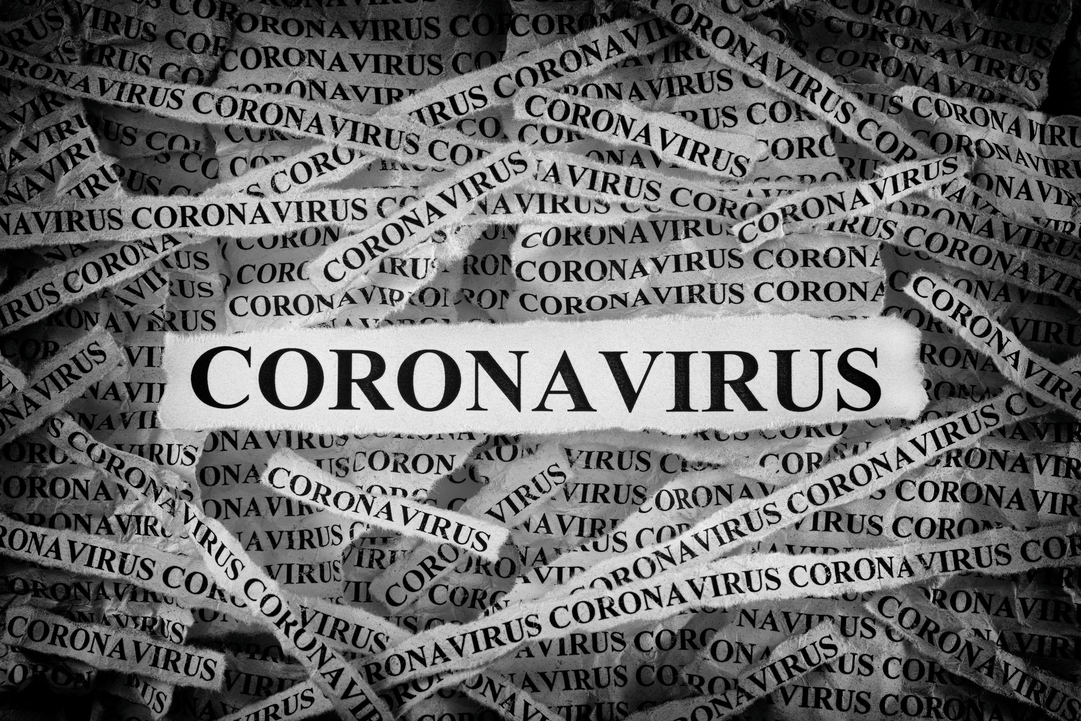 many strips of newsprint all reading coronavirus v2